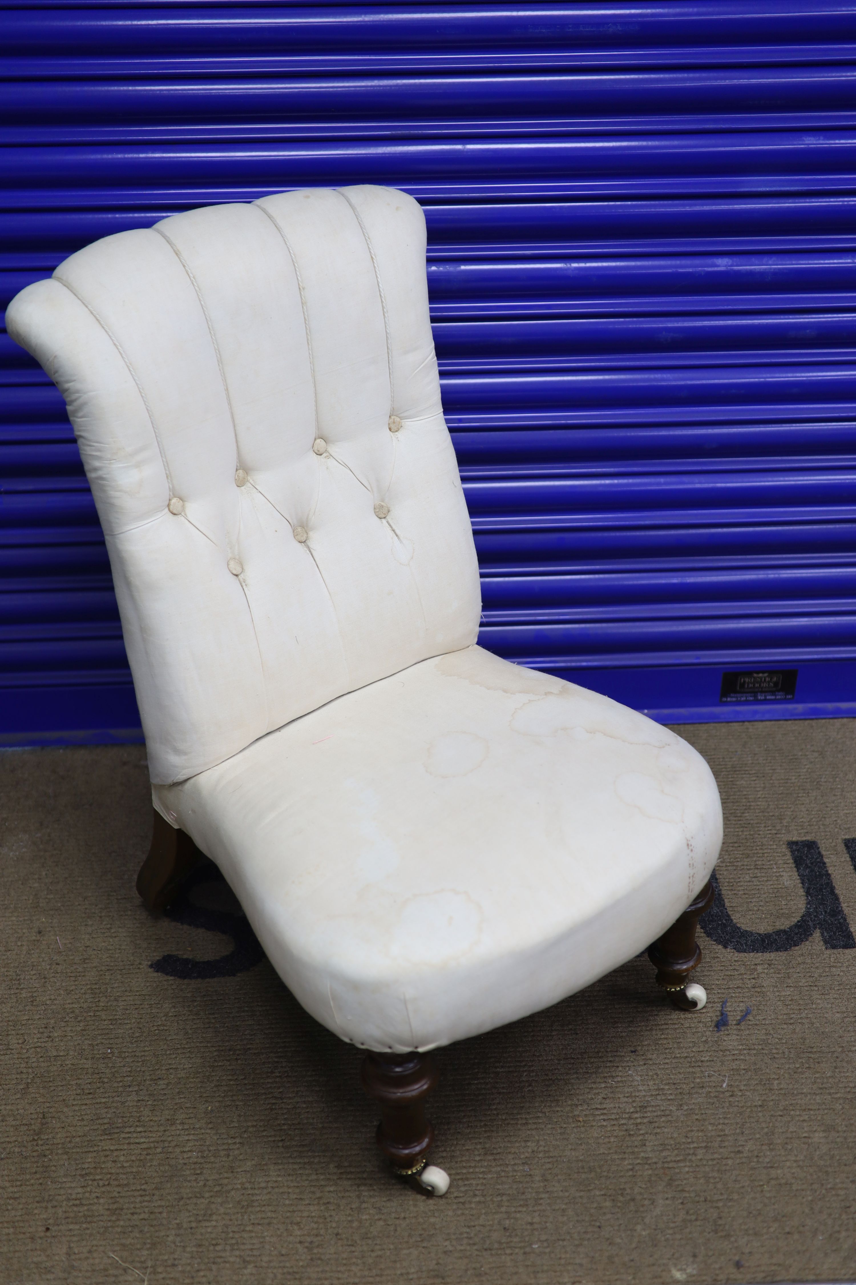 A Victorian walnut framed button back nursing chair, height 79cms width 47cms